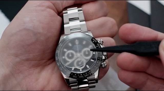 Watch-protection-film-application-on-watch-with-tweezers